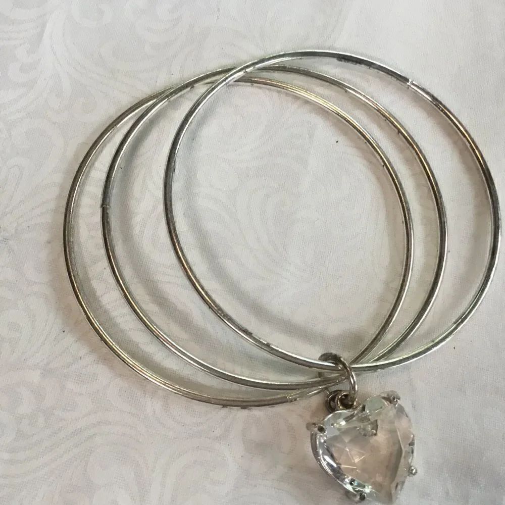 Triple Silvertone Bangles with Clear Heart Charm in Basket Setting